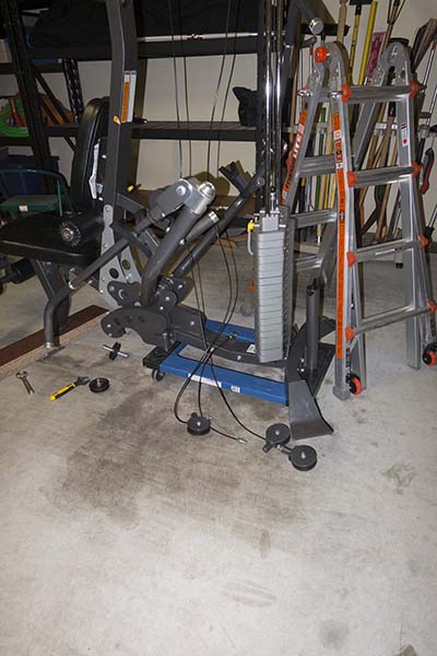 Photograph of Hoist V5 home gym, showing placement atop furniture dolly during assembly process.